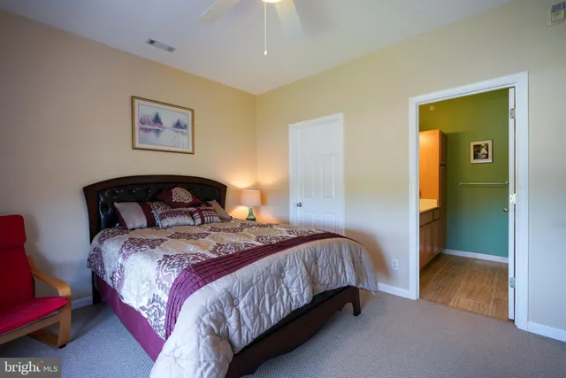 a bedroom with bed and a window