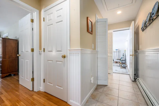 a bathroom with a shower and closet