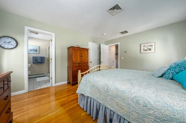 a bedroom with a bed and a table in it