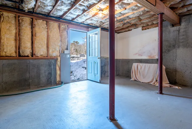 a view of an empty room and window