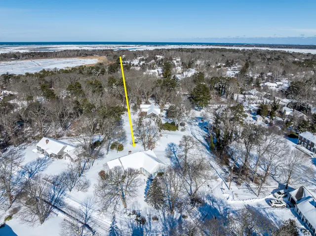 a view of a yard with wooden fence