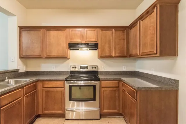 a kitchen with a stove and a microwave