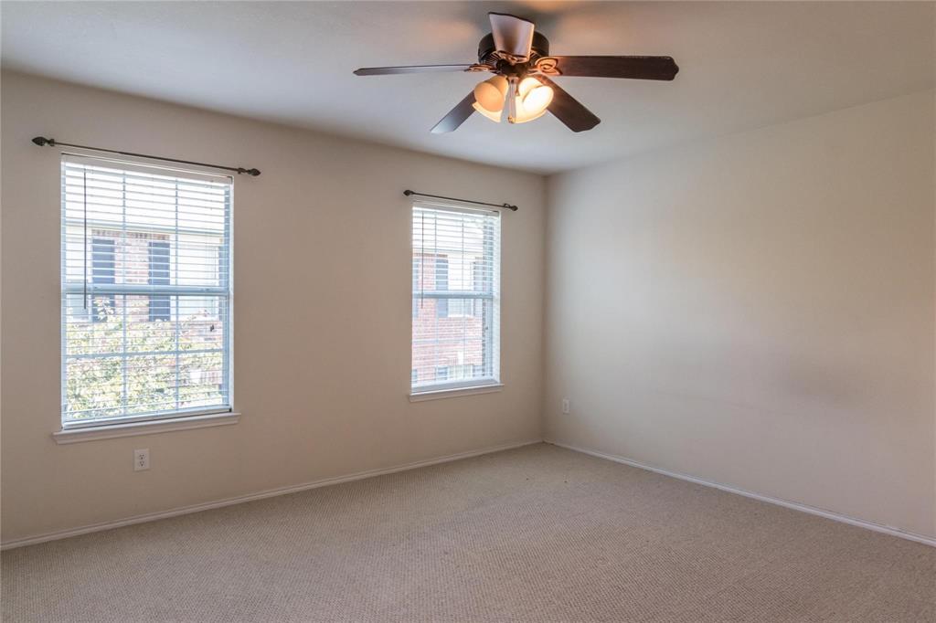 4074 Kyndra Circle Richardson, TX 75082 - Photo 17 of 27 an empty room with a window and a fan