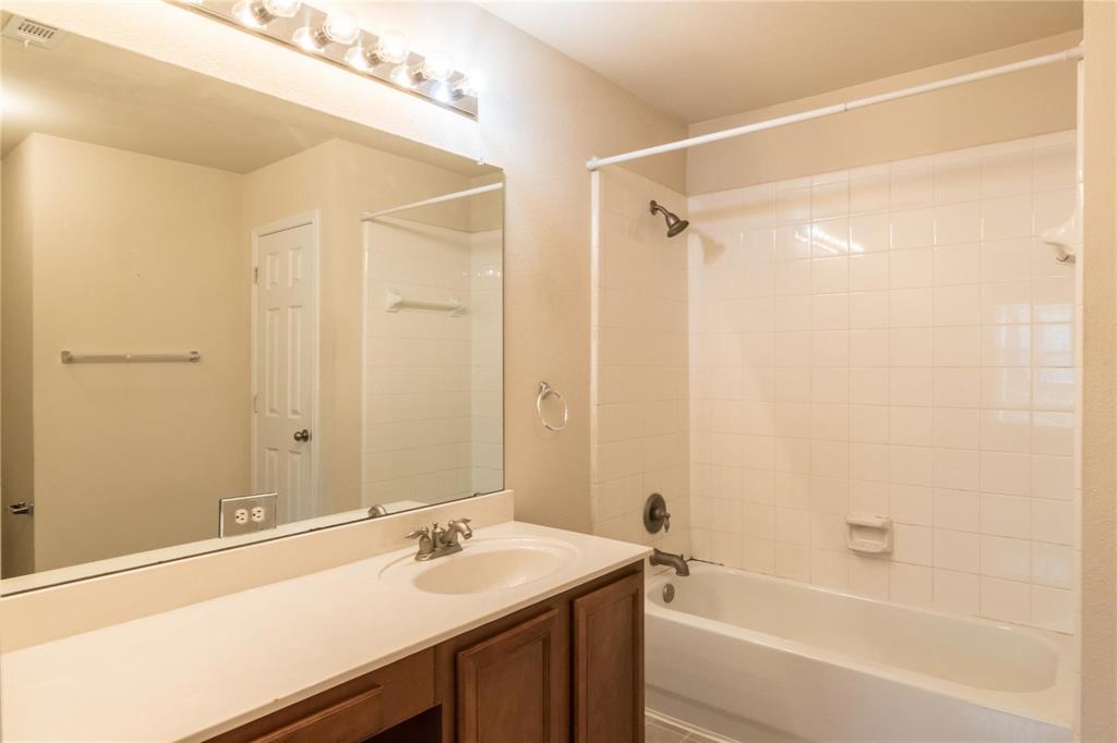 4074 Kyndra Circle Richardson, TX 75082 - Photo 21 of 27 a bathroom with a sink and a mirror