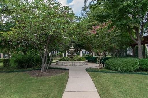 4074 Kyndra Circle Richardson, TX 75082 - Photo 25 of 27 a front view of a house with a yard and tree