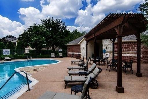 4074 Kyndra Circle Richardson, TX 75082 - Photo 27 of 27 a view of a house with swimming pool and sitting area