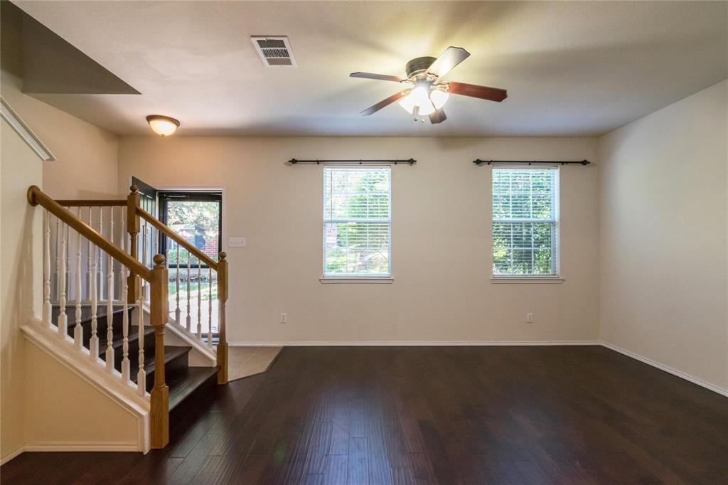 4074 Kyndra Circle Richardson, TX 75082 - Photo 3 of 27 a view of an empty room with wooden floor and a window