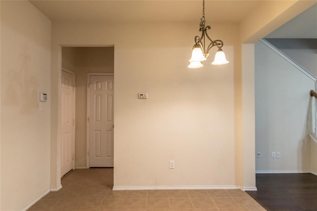 4074 Kyndra Circle Richardson, TX 75082 - Photo 9 of 27 a view of a room with a chandelier fan