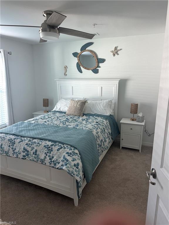 43041 Greenway Boulevard, Unit 921 Babcock Ranch, FL 33982 - Photo 11 of 15 a bedroom with a bed and window