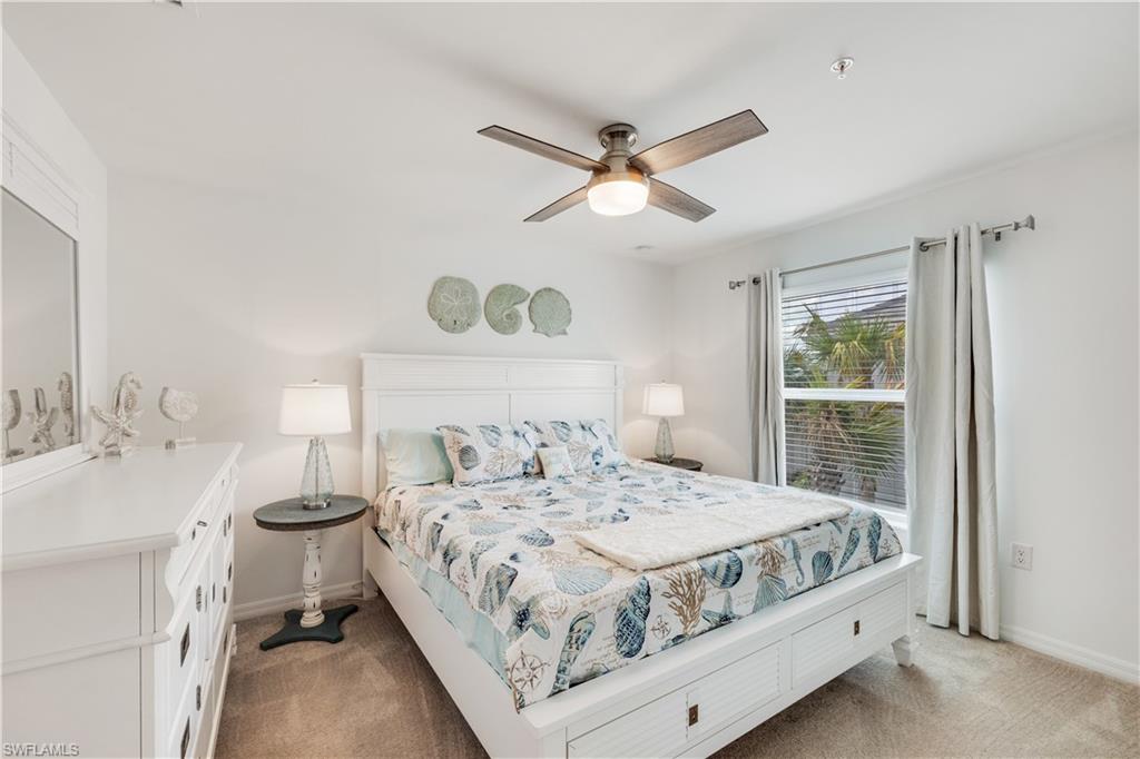 43041 Greenway Boulevard, Unit 921 Babcock Ranch, FL 33982 - Photo 12 of 15 a bedroom with a bed and a table