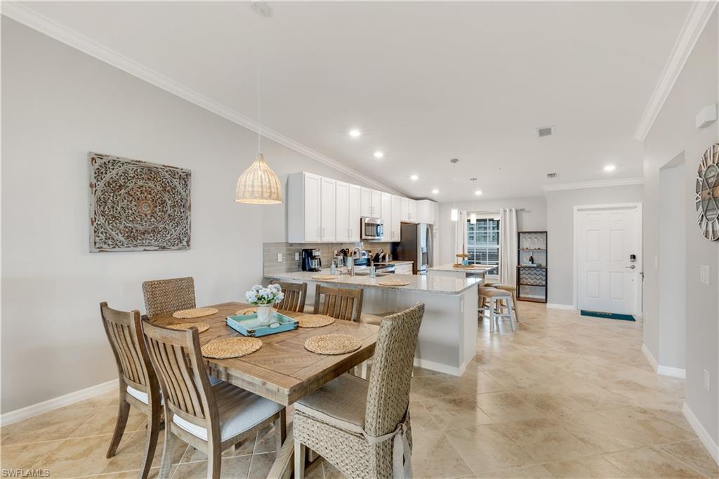 43041 Greenway Boulevard, Unit 921 Babcock Ranch, FL 33982 - Photo 4 of 15 a view of a dining room with furniture