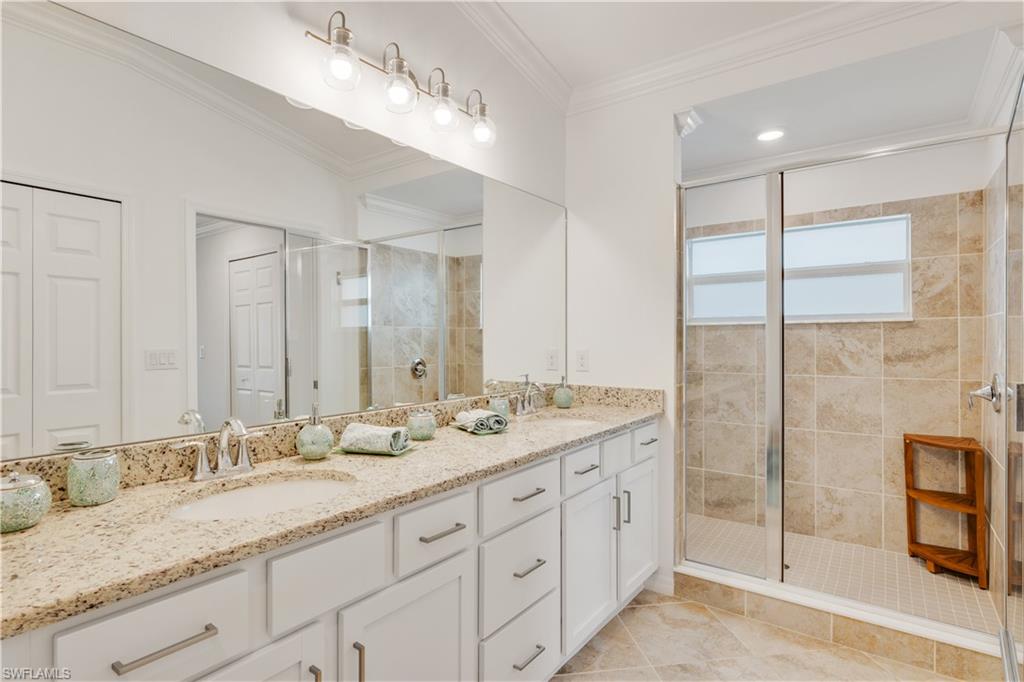 43041 Greenway Boulevard, Unit 921 Babcock Ranch, FL 33982 - Photo 10 of 15 a bathroom with double sink and a mirror