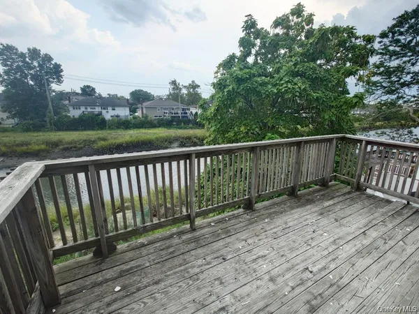 a view of deck with wooden floor and fence