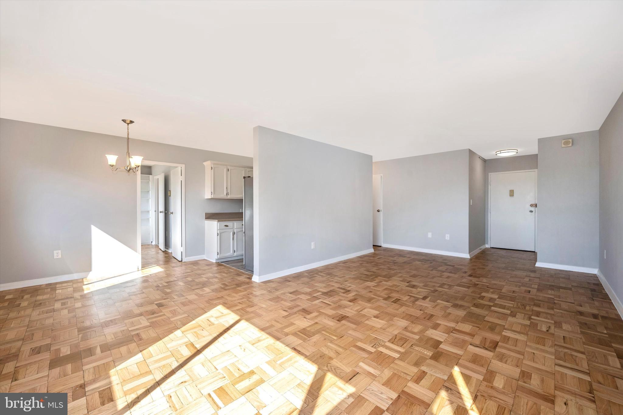 4600 Connecticut Avenue Northwest, Unit 810 Washington, DC 20008 - Photo 11 of 44 Living room and dining room and front door