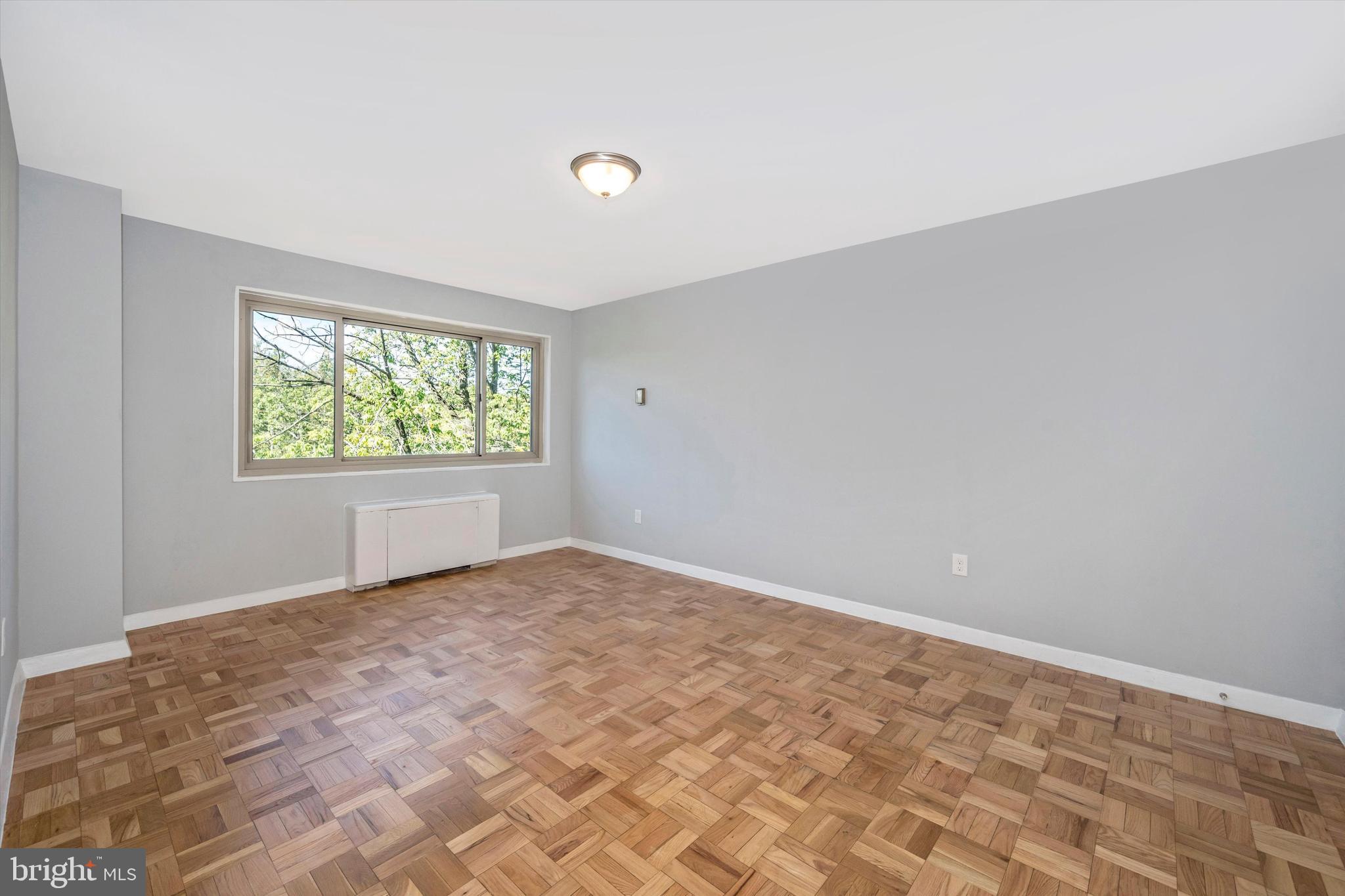 4600 Connecticut Avenue Northwest, Unit 810 Washington, DC 20008 - Photo 16 of 44 Primary bedroom with views of building 's park