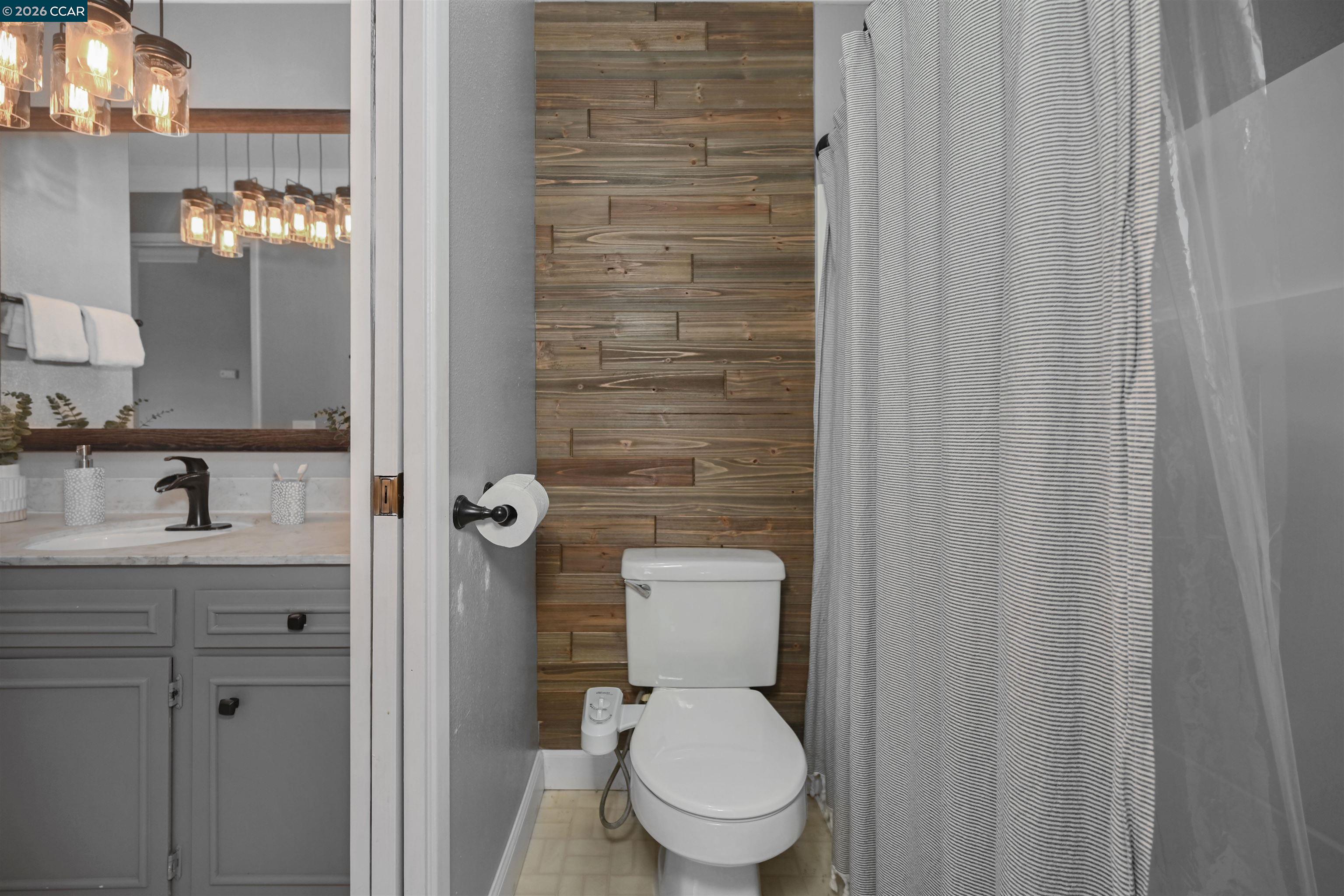 825 Oak Grove Road, Unit 46 Concord, CA 94518 - Photo 30 of 32 a bathroom with a toilet a sink and view