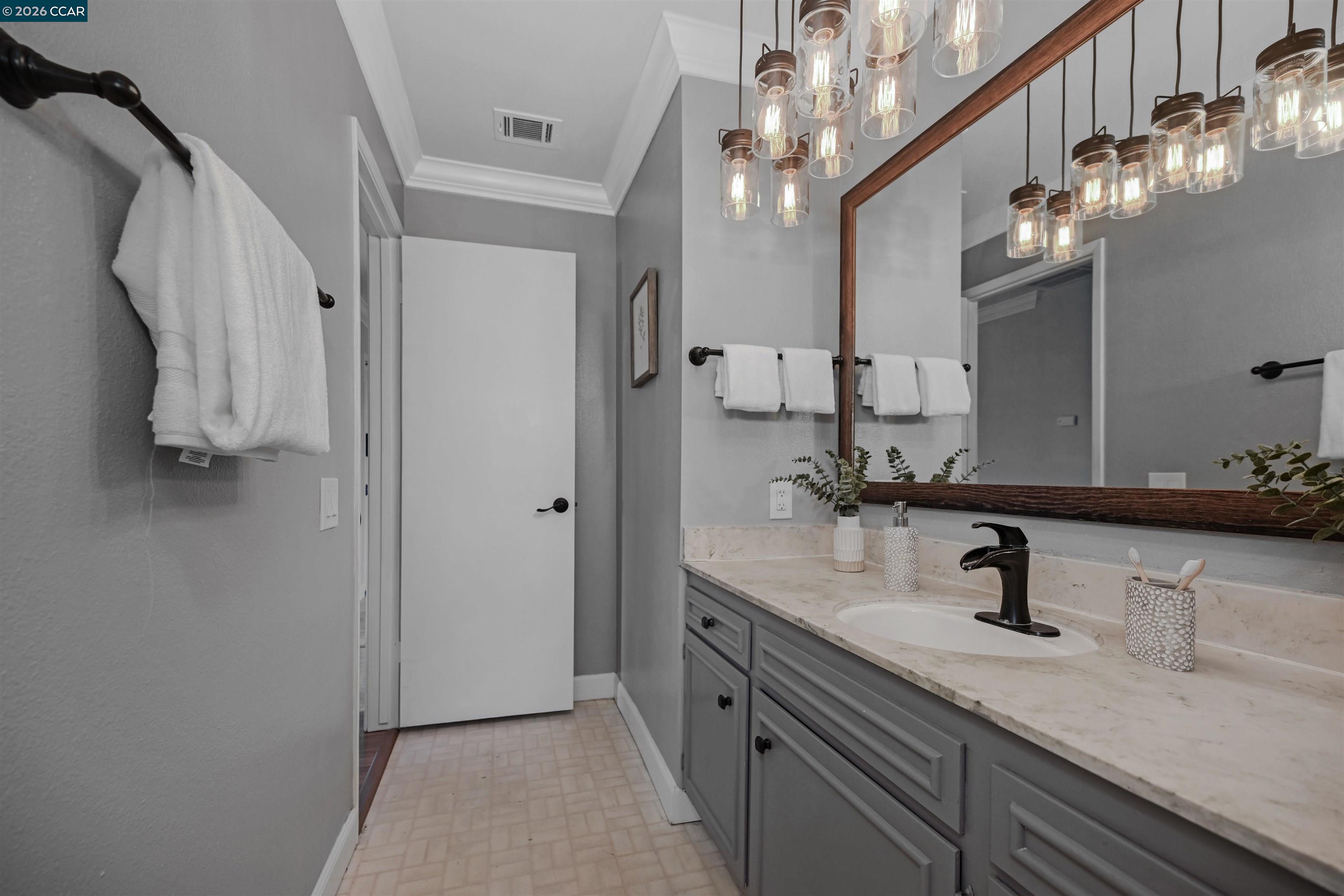 825 Oak Grove Road, Unit 46 Concord, CA 94518 - Photo 31 of 32 a bathroom with a sink a light fixture and a mirror