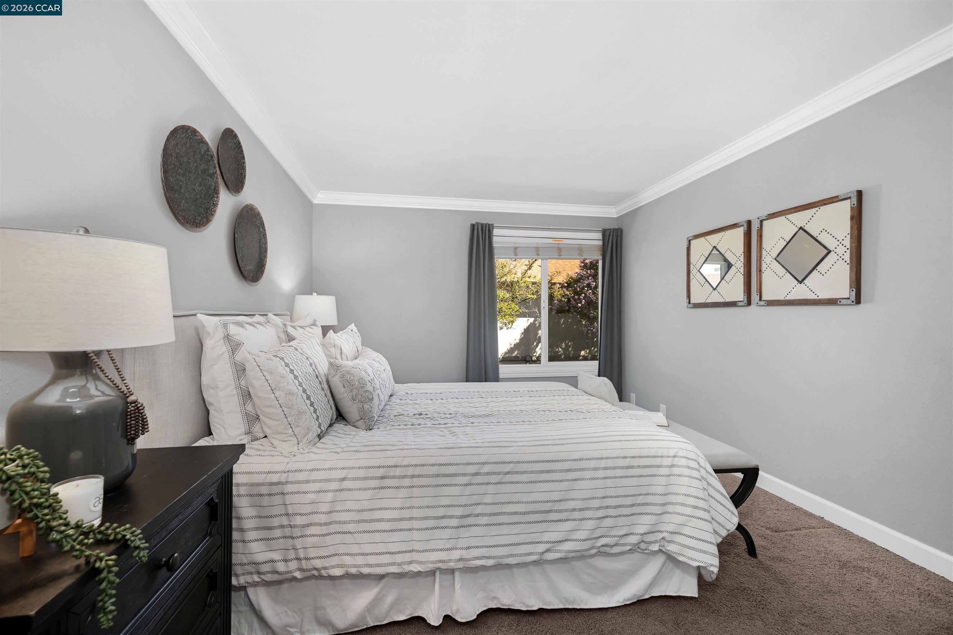 825 Oak Grove Road, Unit 46 Concord, CA 94518 - Photo 9 of 32 a bedroom with a bed and cabinets