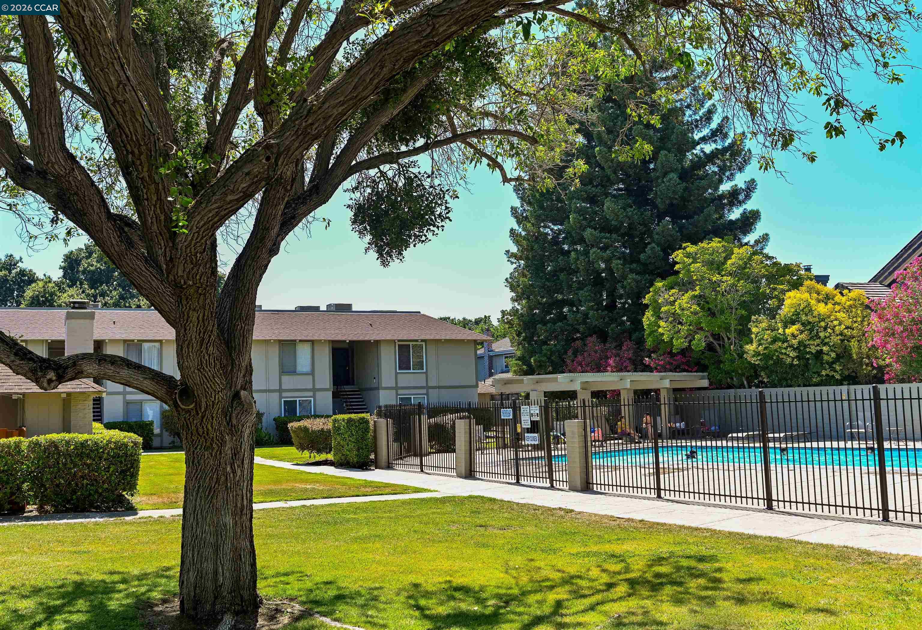 825 Oak Grove Road, Unit 46 Concord, CA 94518 - Photo 10 of 32 a house view with swimming pool in front of it