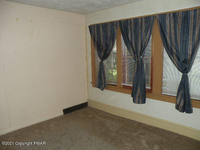 169 Tanite Road Stroudsburg, PA 18360 - Photo 4 of 22 an empty room with windows