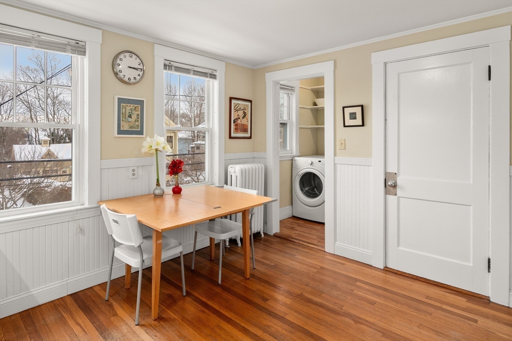 4 Albano Street, Unit 2 Boston, MA 02131 - Photo 13 of 24 a view of a dining room with furniture and wooden floor