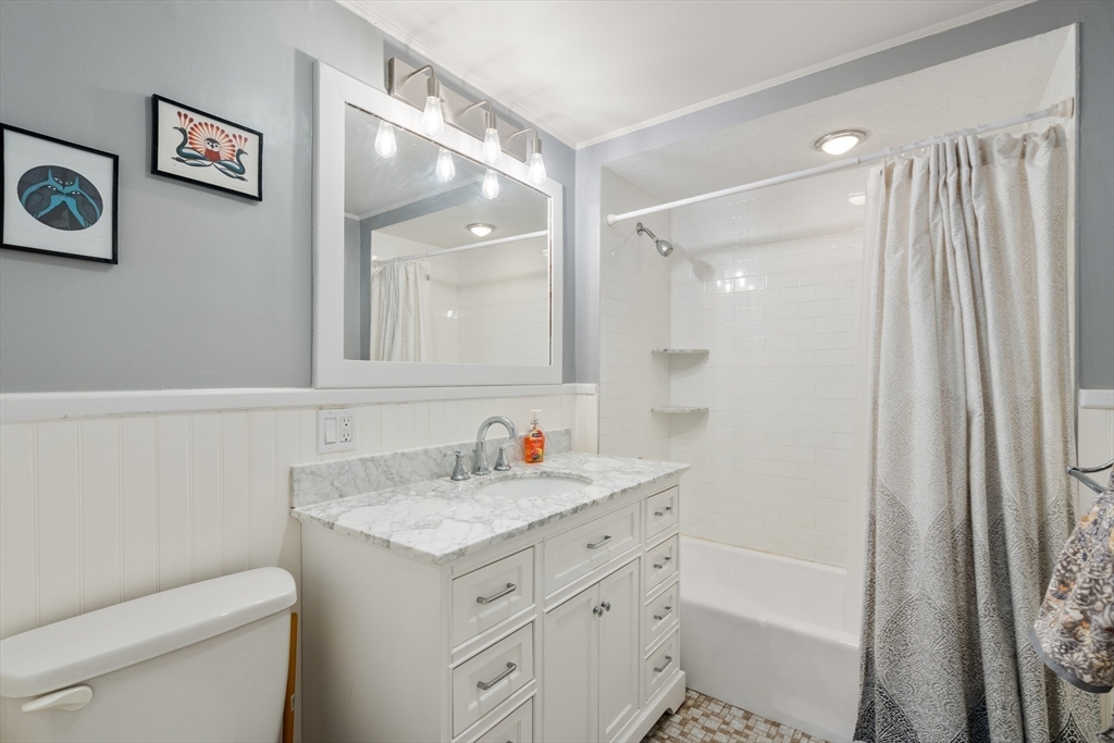 4 Albano Street, Unit 2 Boston, MA 02131 - Photo 16 of 24 a bathroom with a sink toilet vanity and tub