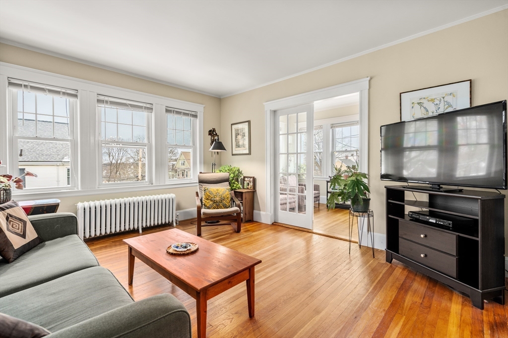4 Albano Street, Unit 2 Boston, MA 02131 - Photo 4 of 24 a living room with furniture and a flat screen tv