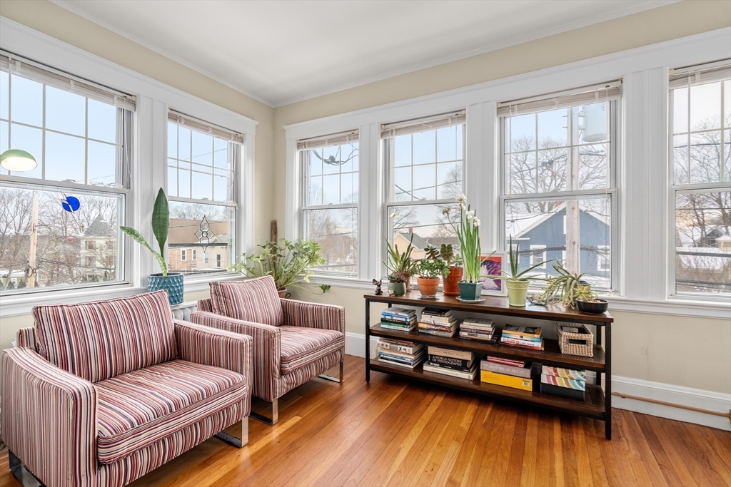 4 Albano Street, Unit 2 Boston, MA 02131 - Photo 6 of 24 a living room with furniture and a wooden floor