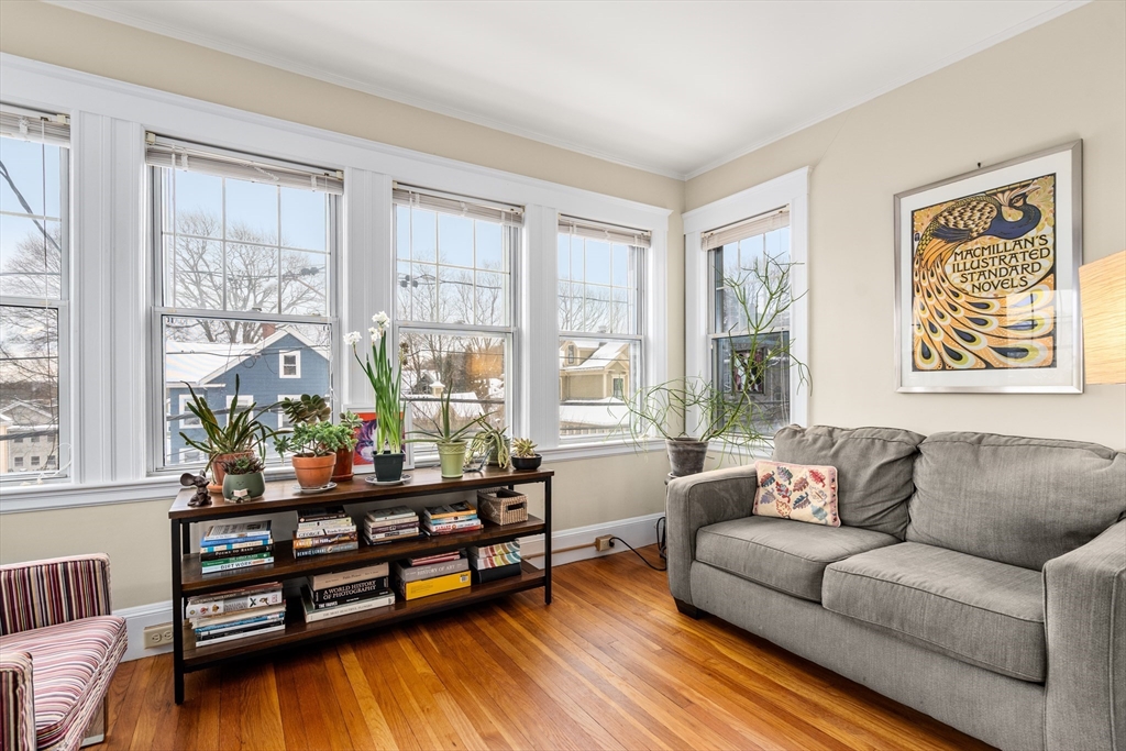 4 Albano Street, Unit 2 Boston, MA 02131 - Photo 7 of 24 a living room with furniture and a large window
