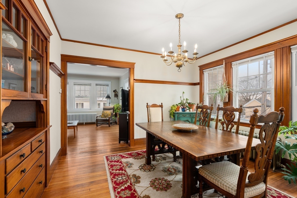 4 Albano Street, Unit 2 Boston, MA 02131 - Photo 9 of 24 a view of a dining room with furniture window and wooden floor