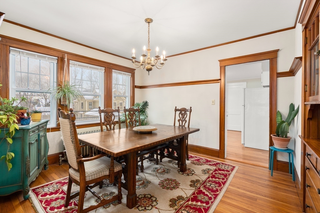 4 Albano Street, Unit 2 Boston, MA 02131 - Photo 10 of 24 a view of a dining room with furniture window and wooden floor