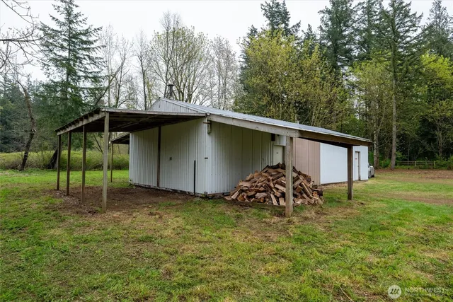 a house with green field in front of it