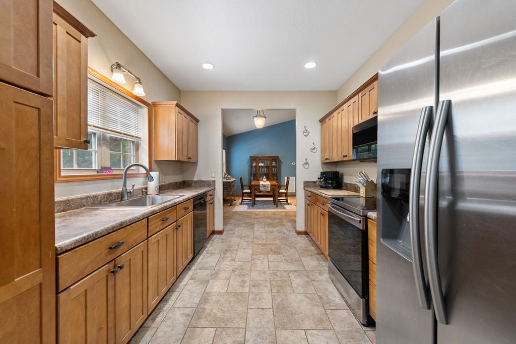 516 Crawford Road Blairsville, GA 30512 - Photo 14 of 49 a large kitchen with stainless steel appliances lots of counter space a sink and a refrigerator