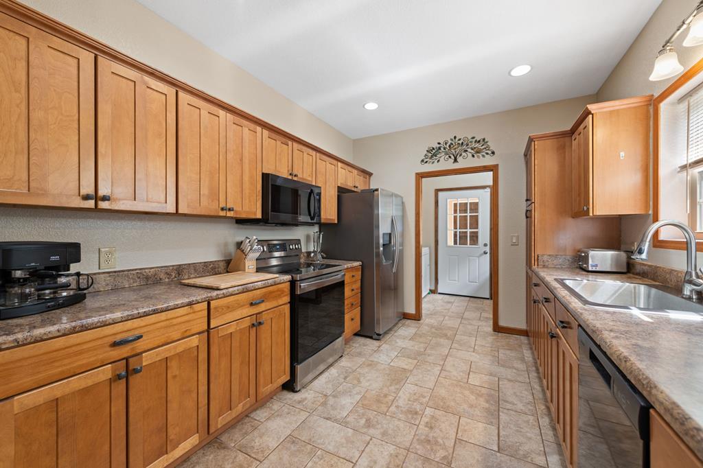 516 Crawford Road Blairsville, GA 30512 - Photo 17 of 49 a kitchen with stainless steel appliances granite countertop a stove sink and cabinets