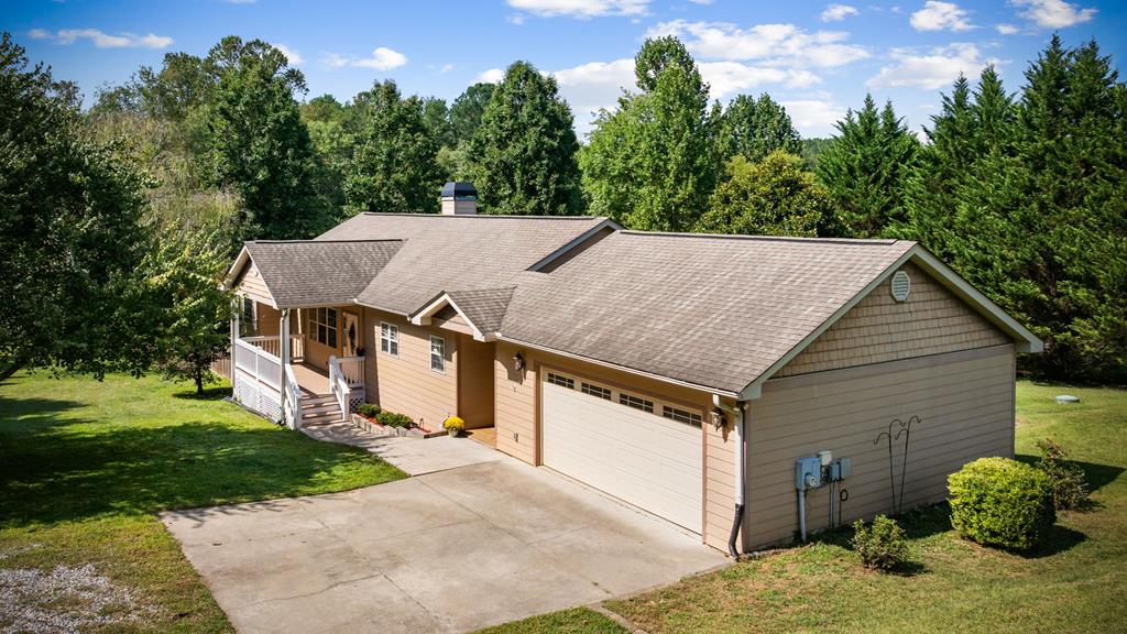 516 Crawford Road Blairsville, GA 30512 - Photo 2 of 49 a view of a house with a yard and garage