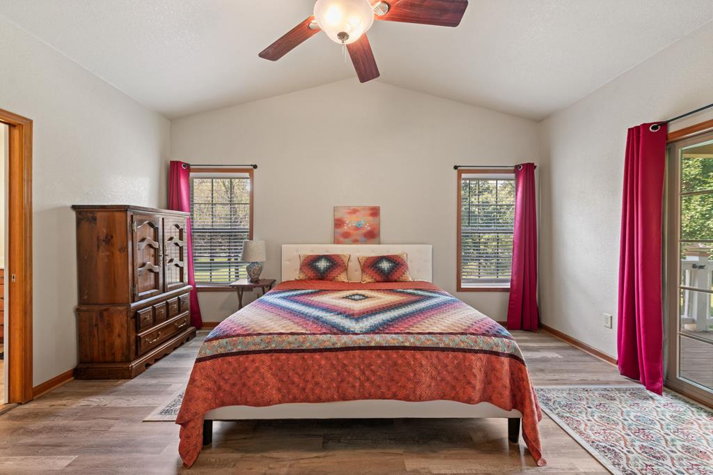 516 Crawford Road Blairsville, GA 30512 - Photo 21 of 49 a bedroom with a bed closet and flat screen tv