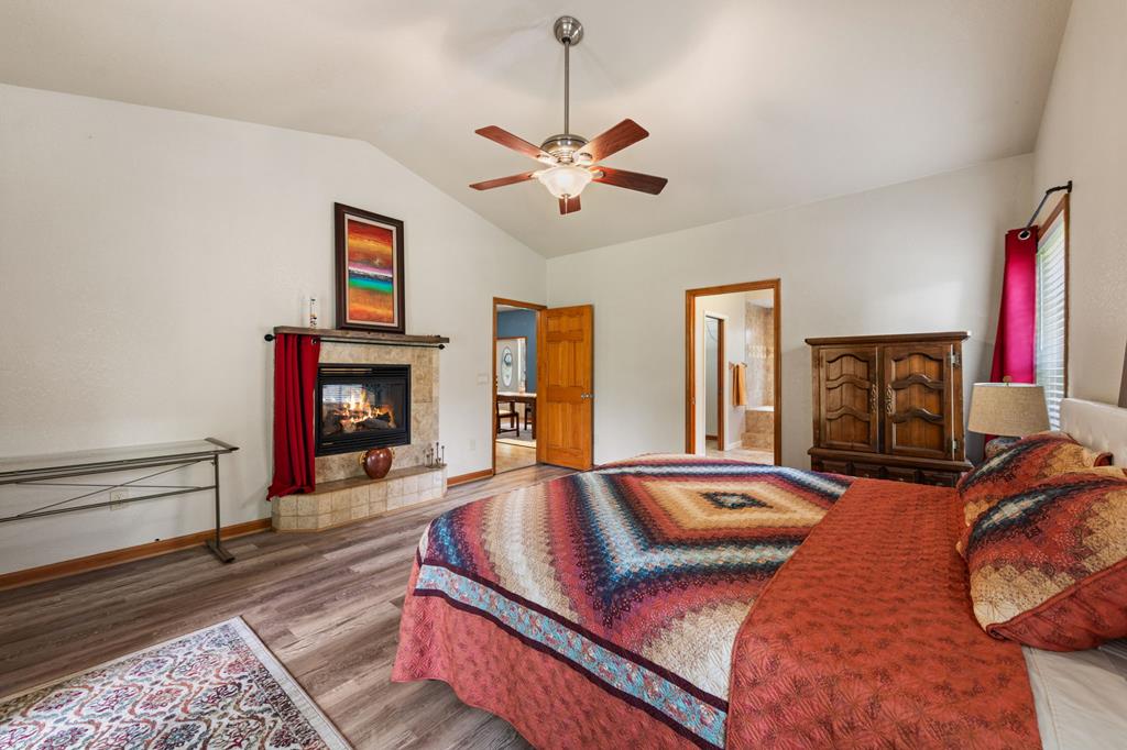 516 Crawford Road Blairsville, GA 30512 - Photo 22 of 49 a bedroom with a bed and a fireplace