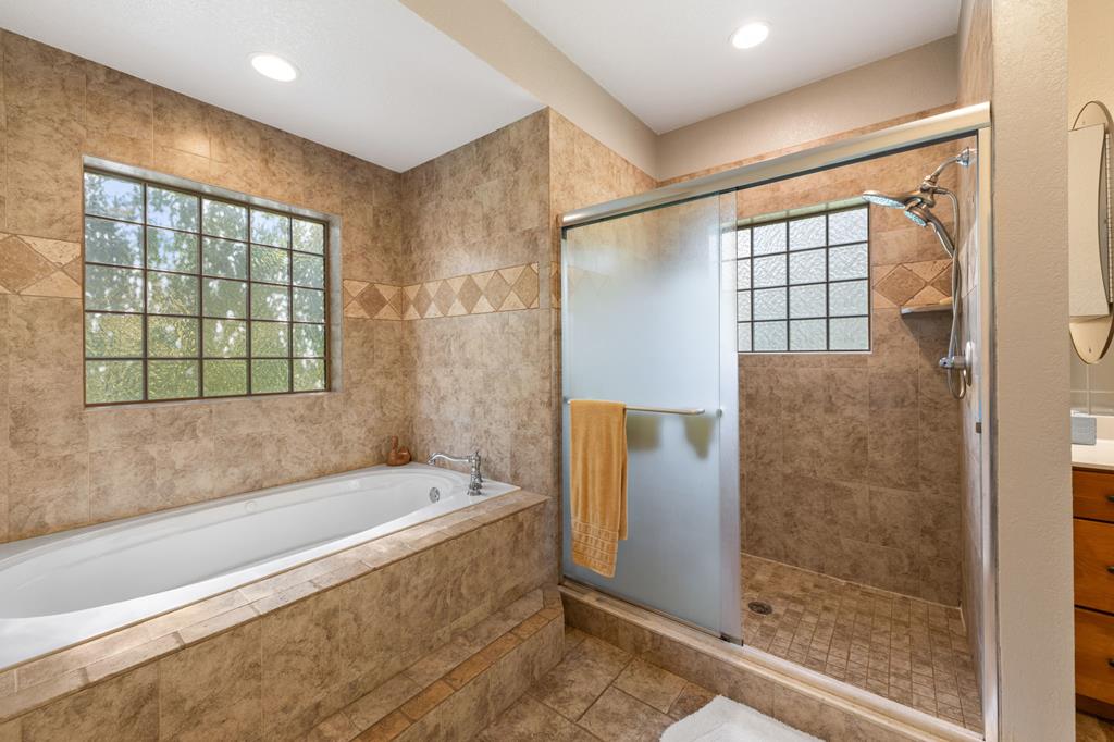 516 Crawford Road Blairsville, GA 30512 - Photo 23 of 49 a bathroom with a bathtub and a shower