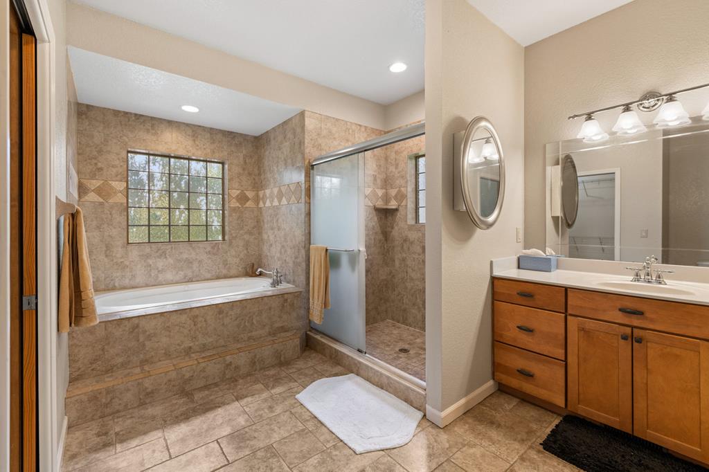 516 Crawford Road Blairsville, GA 30512 - Photo 25 of 49 a bathroom with a double vanity sink toilet and shower