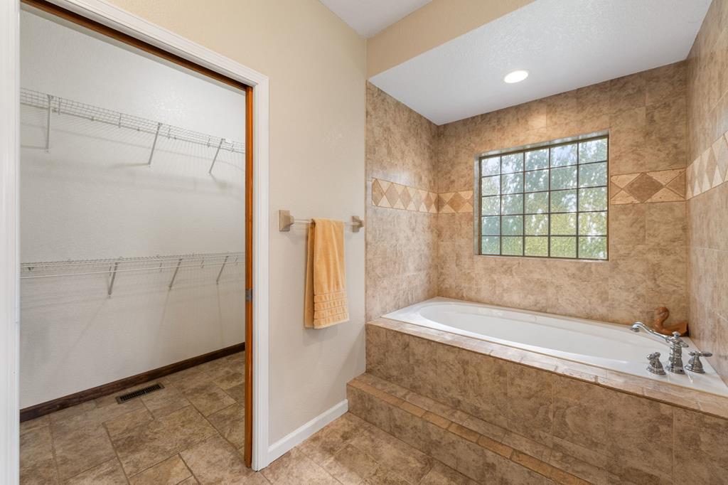516 Crawford Road Blairsville, GA 30512 - Photo 26 of 49 a spacious bathroom with a tub shower and sink