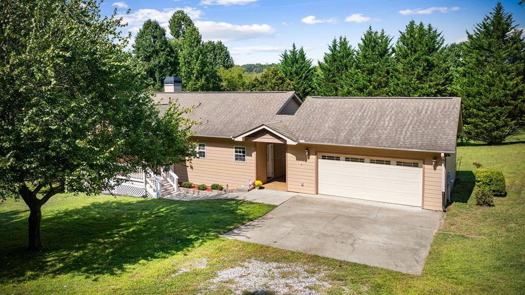 516 Crawford Road Blairsville, GA 30512 - Photo 3 of 49 a front view of a house with a yard and garage