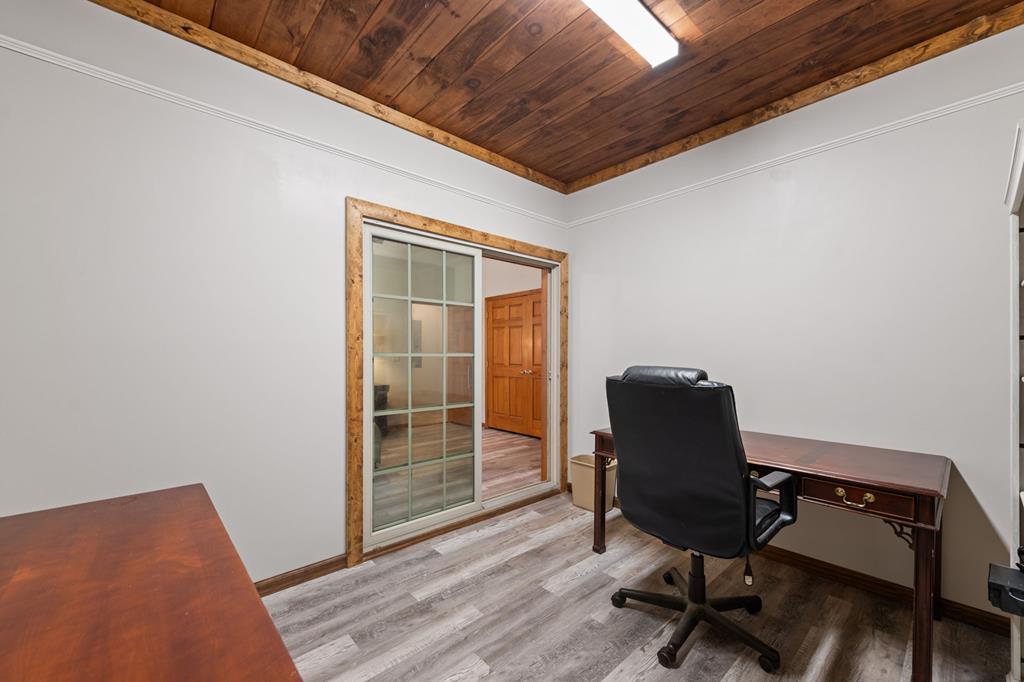 516 Crawford Road Blairsville, GA 30512 - Photo 32 of 49 a view of a workspace with furniture and wooden floor