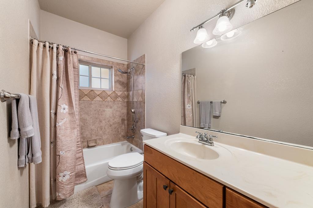 516 Crawford Road Blairsville, GA 30512 - Photo 34 of 49 a bathroom with a sink a toilet a mirror and shower