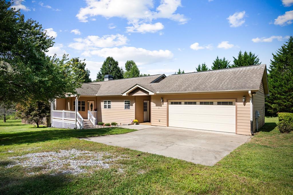 516 Crawford Road Blairsville, GA 30512 - Photo 43 of 49 a front view of a house with a yard and garage