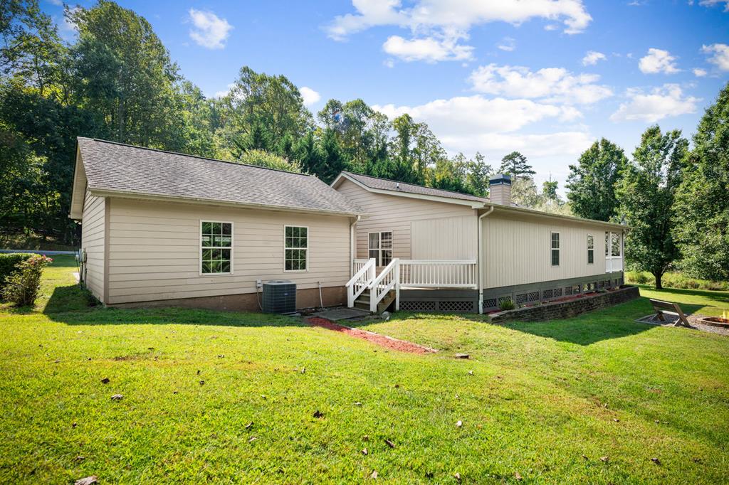 516 Crawford Road Blairsville, GA 30512 - Photo 47 of 49 a view of a house with a backyard and a tree