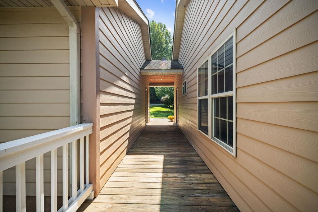 516 Crawford Road Blairsville, GA 30512 - Photo 48 of 49 a view of a balcony with wooden floor and floor to ceiling window