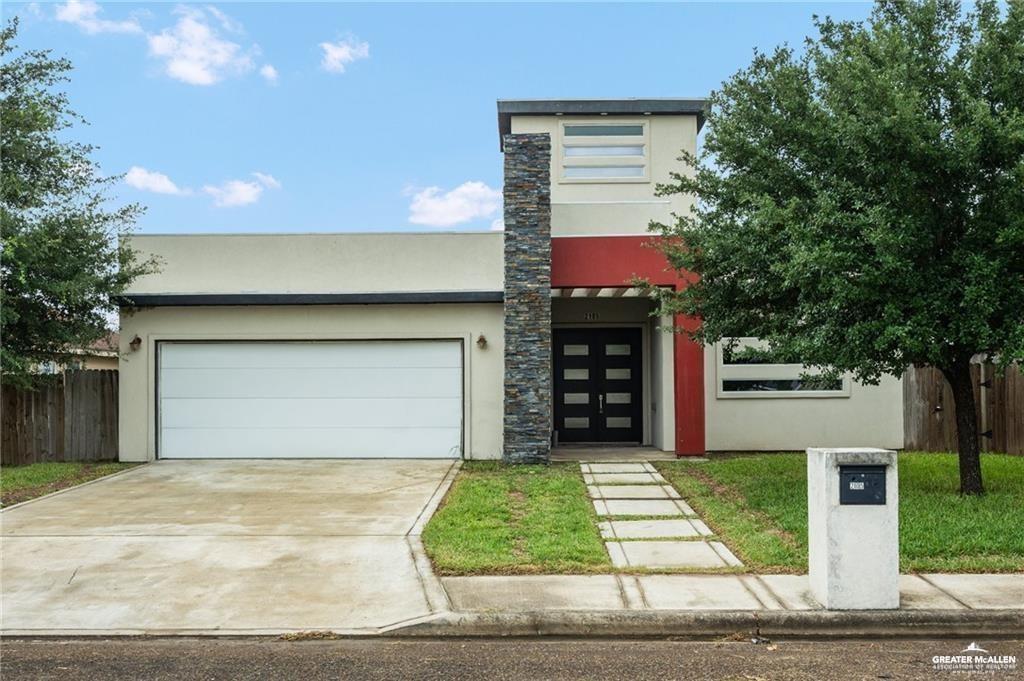 2105 Azalea Street Mission, TX 78573 - Photo 1 of 14 a front view of house with yard