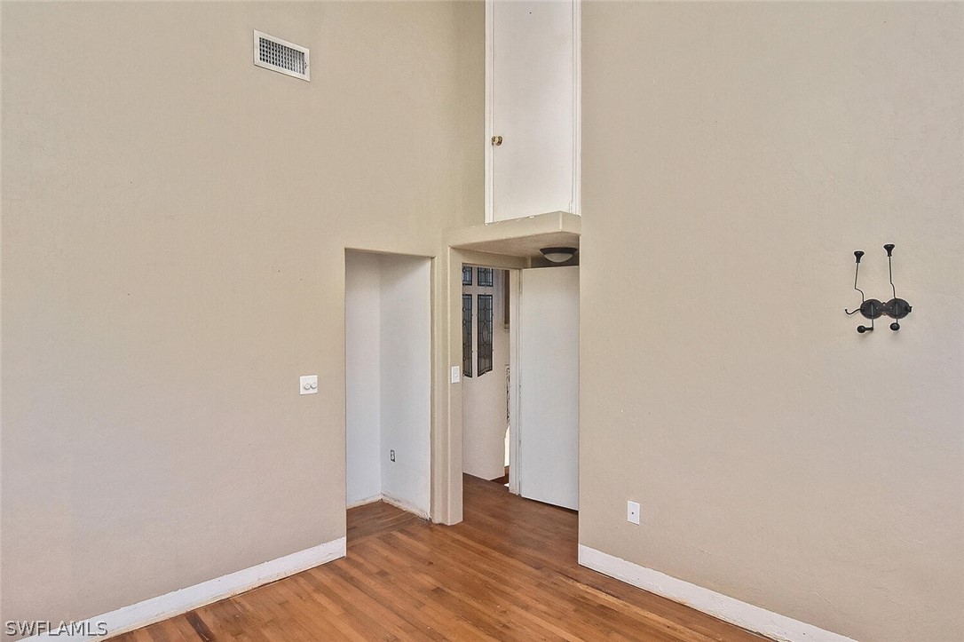 2480 Library Way Sanibel, FL 33957 - Photo 17 of 33 a view of a room with wooden floor