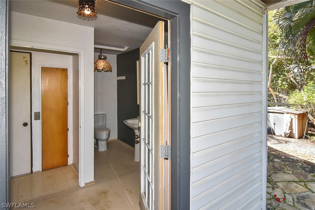 2480 Library Way Sanibel, FL 33957 - Photo 26 of 33 a view of a porch with a table and chairs