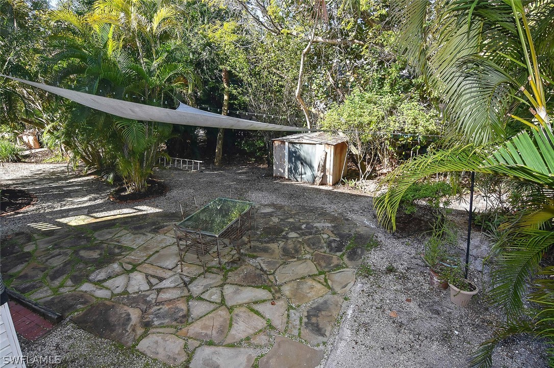 2480 Library Way Sanibel, FL 33957 - Photo 28 of 33 a view of a house with a yard